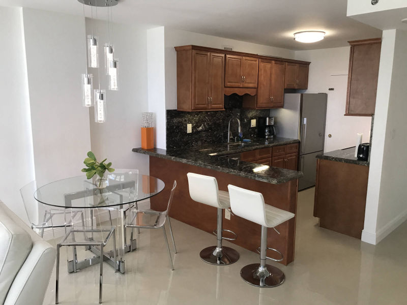 wider shot of kitchen and dining area 