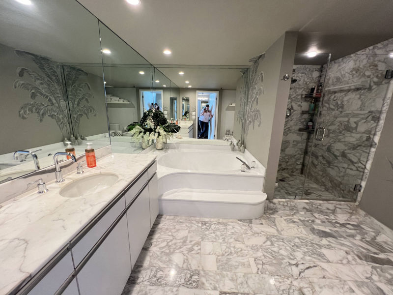 master bathroom with a reflection of the best realtor in Miami Beach Patricia
